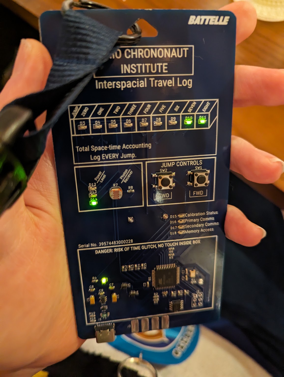 a blue badge with LEDs which says Ohio Chrononaut Institute